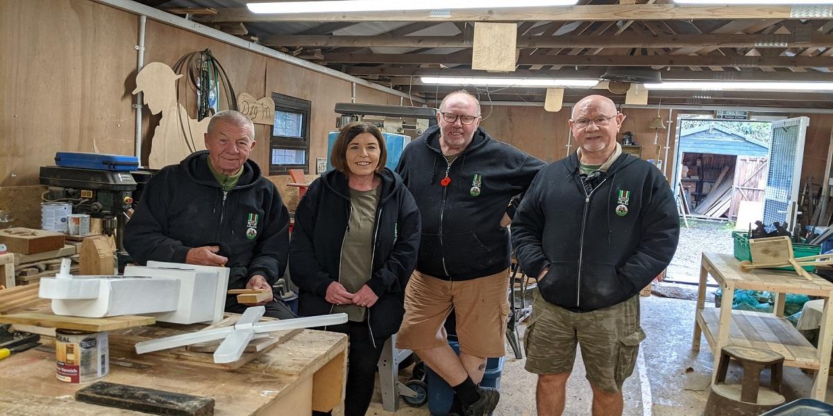 Dig In providing Living Wage Claire Grant with staff and service users in the workshop at Dig In