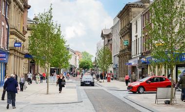 People walking down Fishergate High Street following public realm improvements